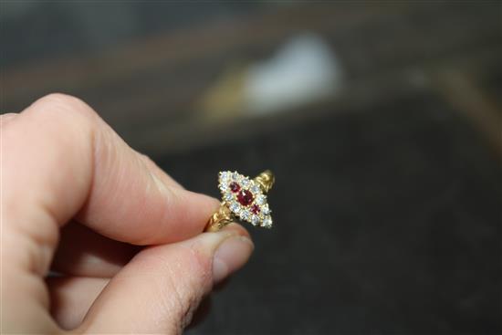 An early-mid 20th century 18ct gold, ruby and diamond marquise cluster ring, size M.